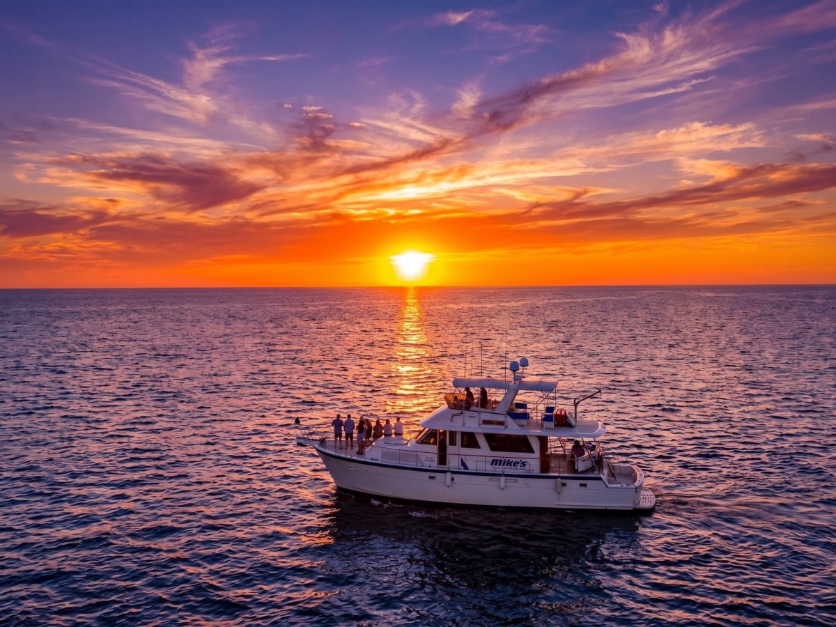 Luxury yacht sailing into the sunset in Puerto Vallarta for a private event.
