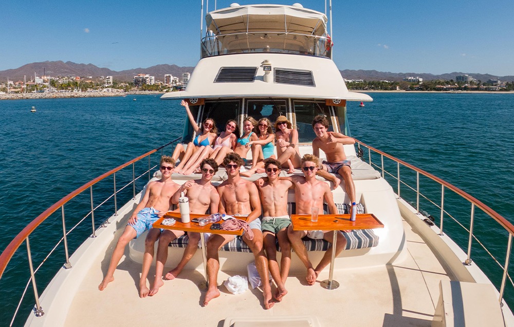 Wide shot of a group of friends enjoying a private yacht charter in Puerto Vallarta.
