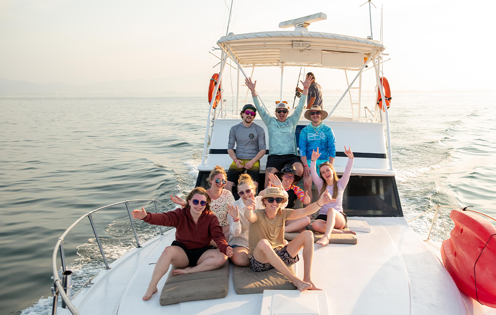Group of friends relaxing on a sportfishing charter in Puerto Vallarta.