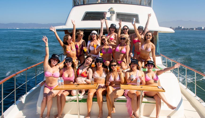 Bridesmaids in matching swimwear celebrating a bachelorette party Puerto Vallarta on a yacht.