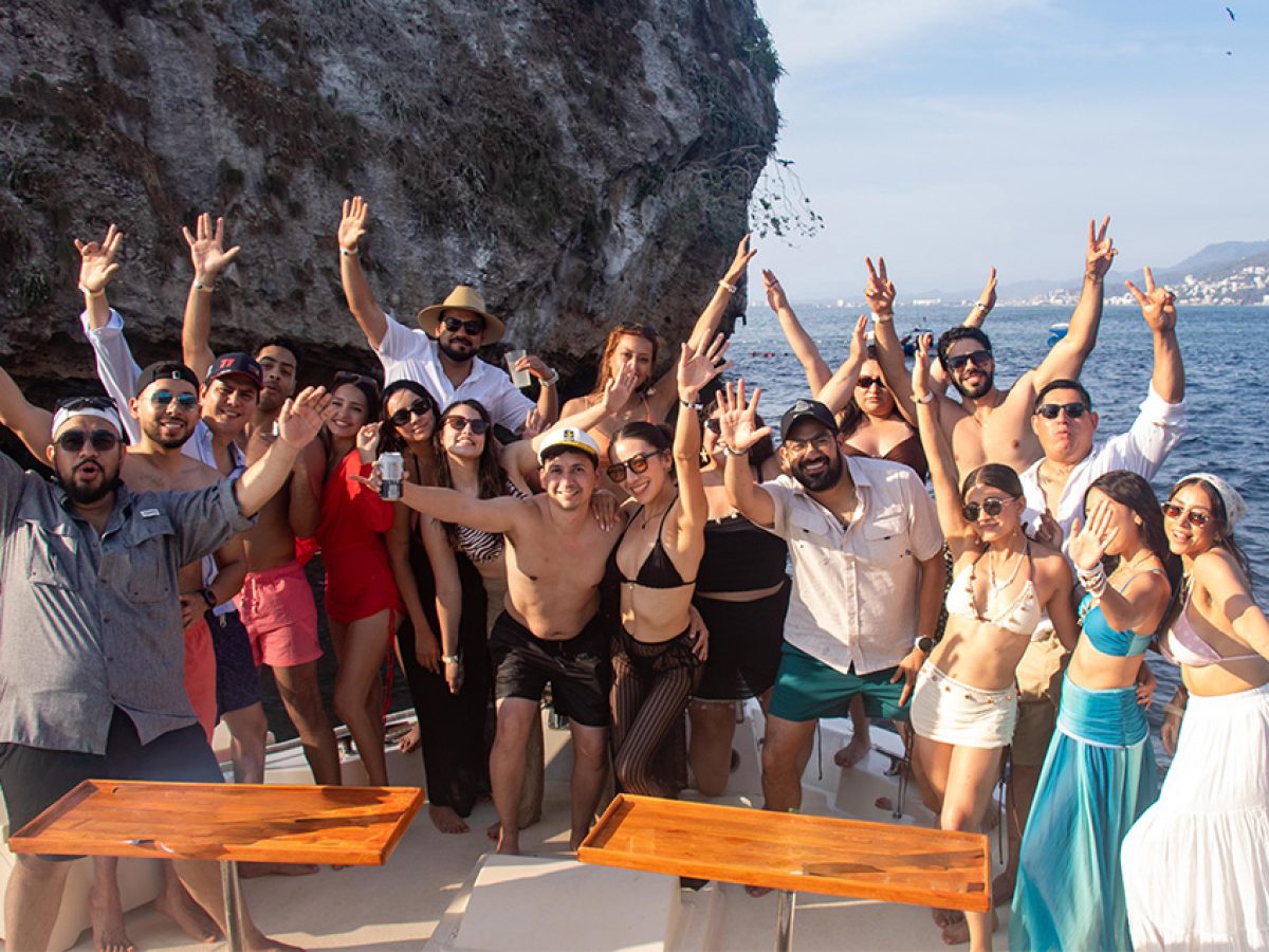 Group celebrating a bachelor party on a luxury private yacht rental in Puerto Vallarta.